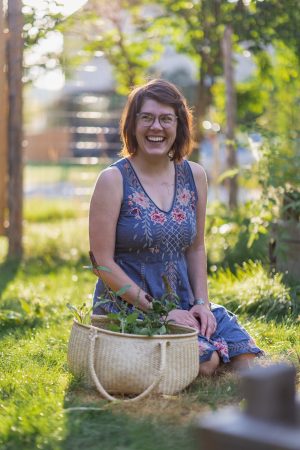 Dr K Mudry sitting in her garden